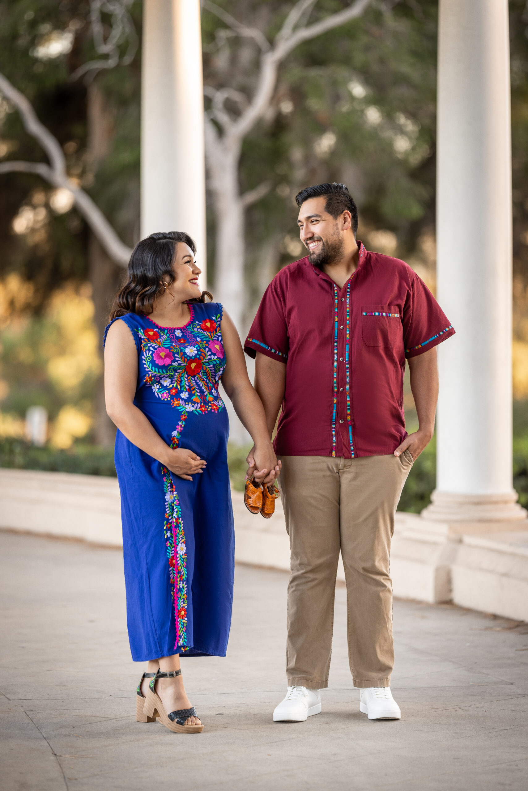 maternity couple in Balboa park with cultural clothes