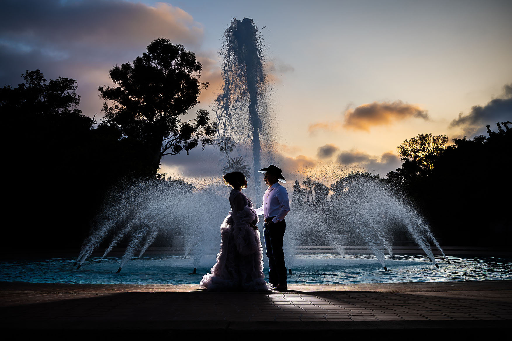 maternity couple in front of fountain Balboa Park