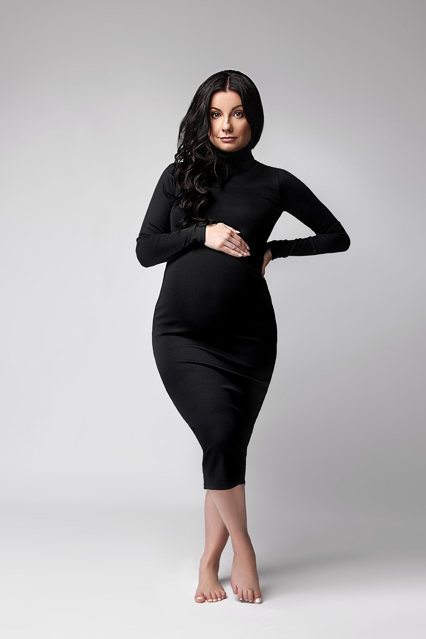 studio maternity photo in black dress at our studio