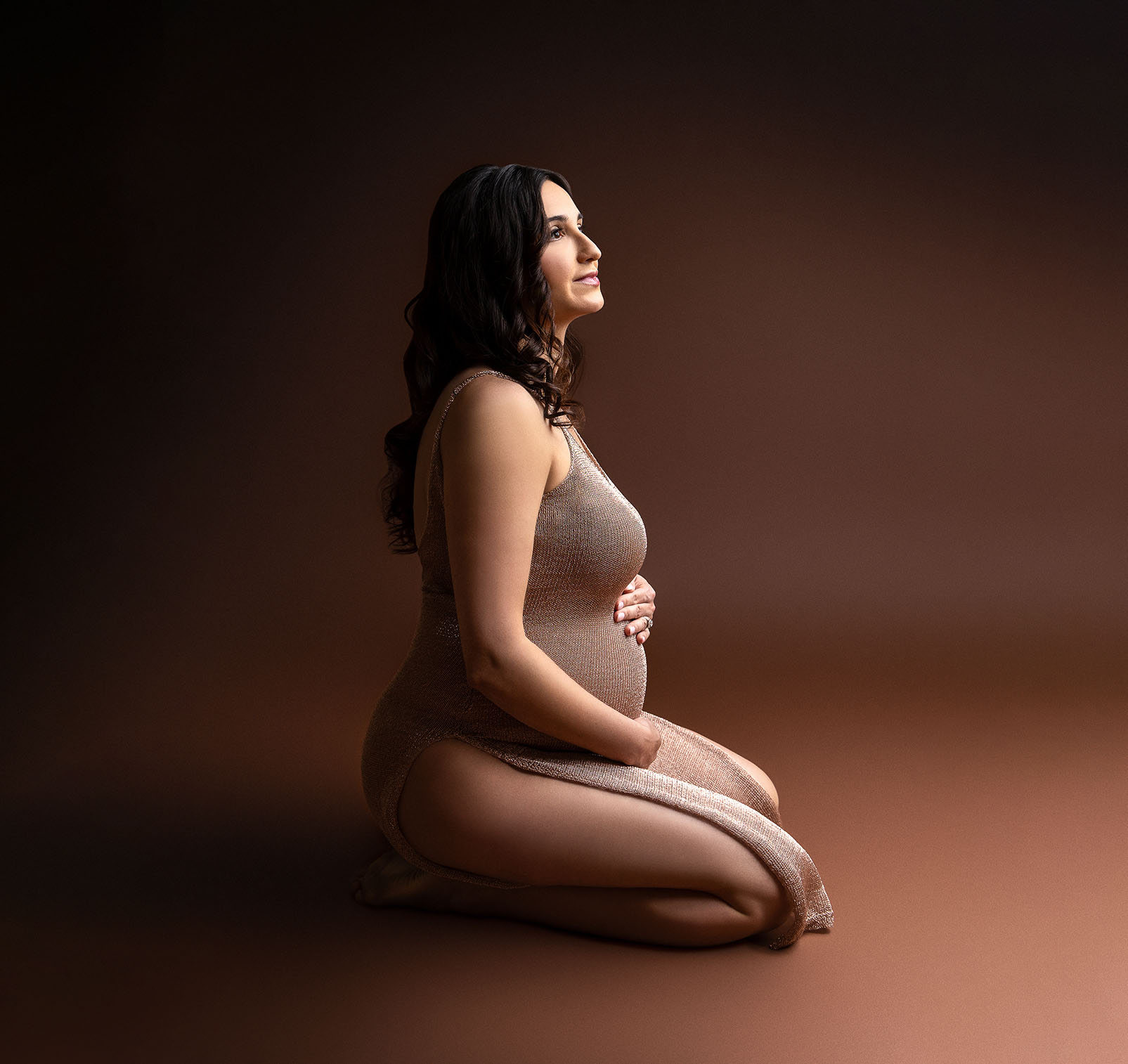 elegant fine art moody portrait in studio of maternity