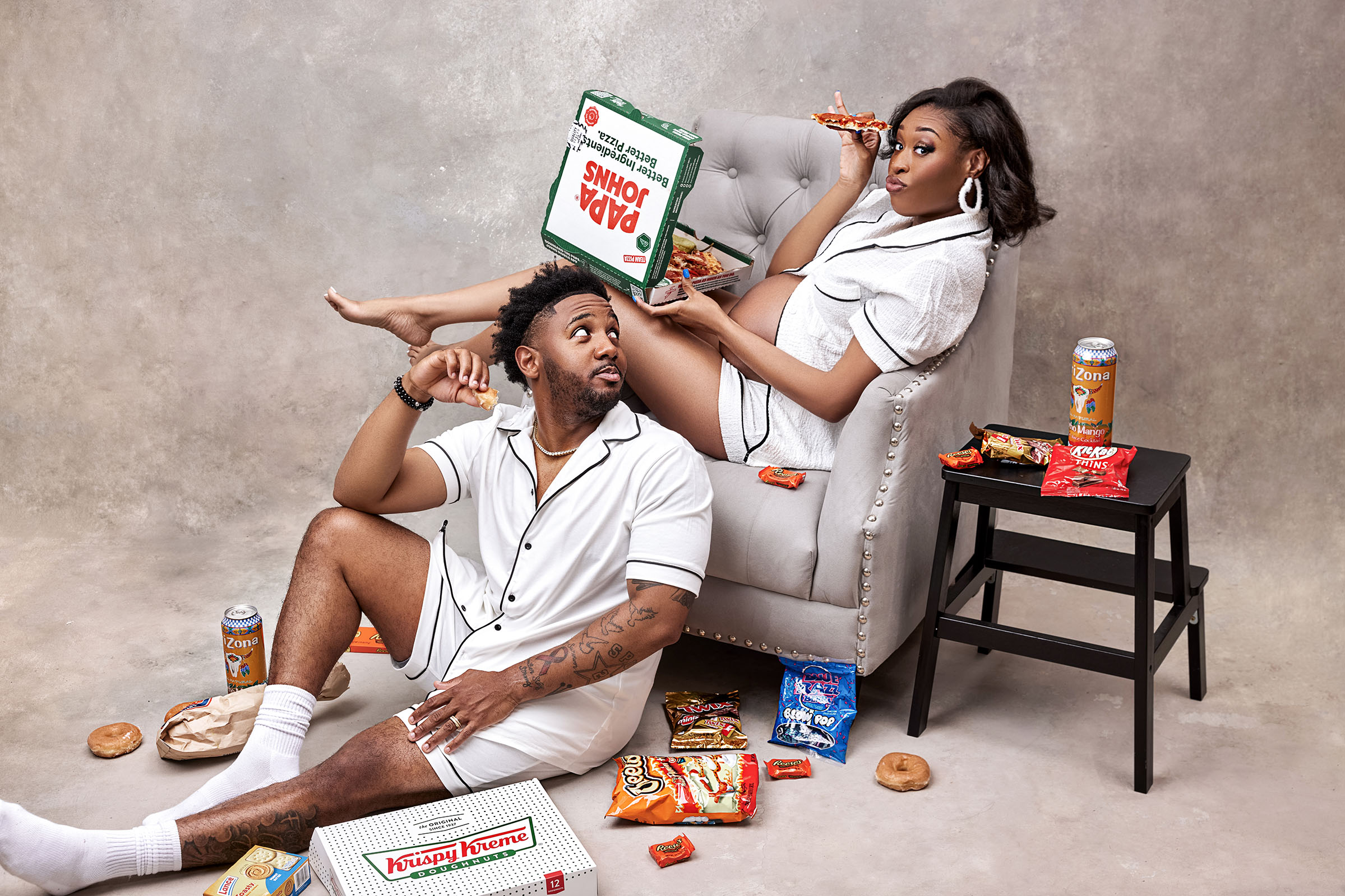 couple in fun outfit with food in studio photo